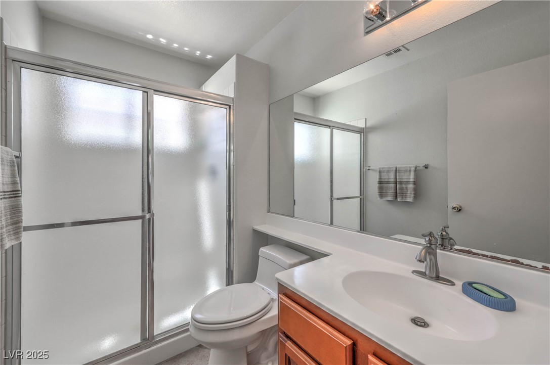 8325 Alta Drive Las Vegas, NV 89145 - Photo 15 of 31 Downstairs Full bathroom with vanity and a shower stall