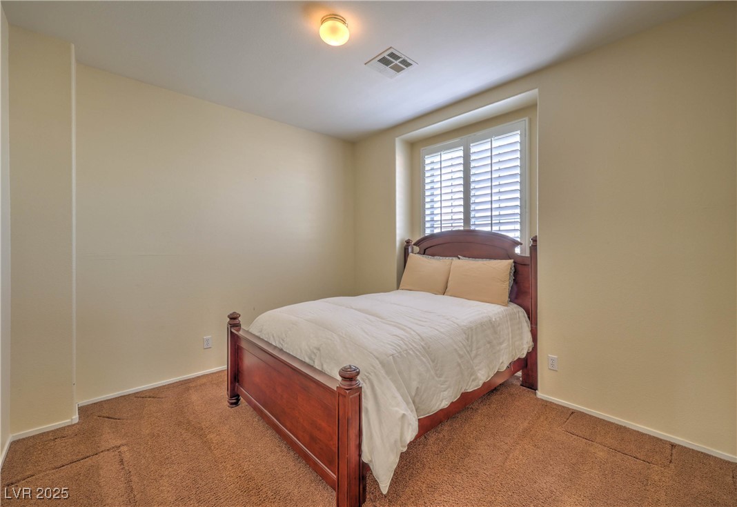 8325 Alta Drive Las Vegas, NV 89145 - Photo 21 of 31 3rd Bedroom featuring carpet floors and baseboards
