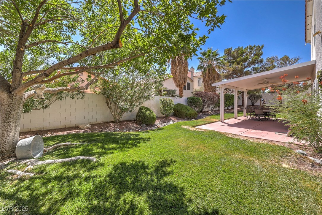 8325 Alta Drive Las Vegas, NV 89145 - Photo 27 of 31 Fenced backyard featuring a patio area