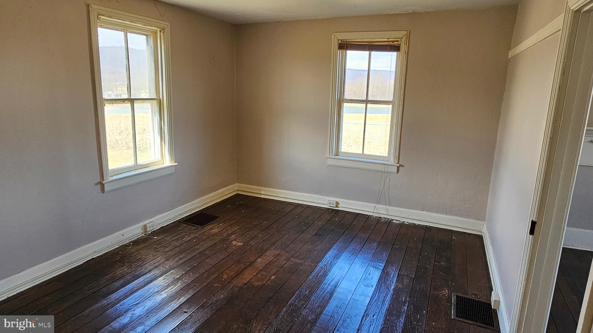 1 26.33 /- Acres Mountain Brook Road St. Thomas, PA 17252 - Photo 29 of 49 an empty room with wooden floor and windows