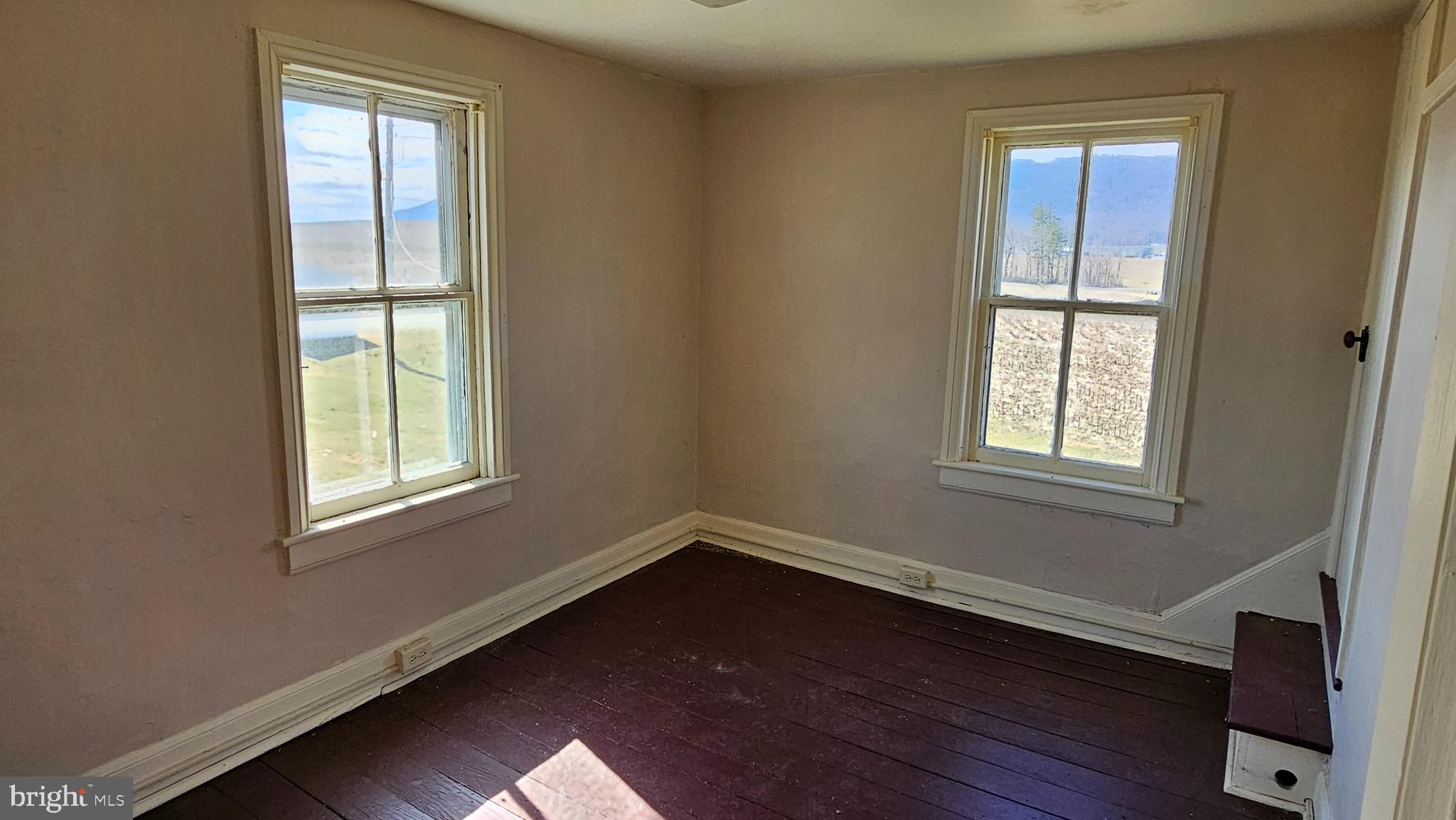 1 26.33 /- Acres Mountain Brook Road St. Thomas, PA 17252 - Photo 34 of 49 a view of an empty room with wooden floor and a window