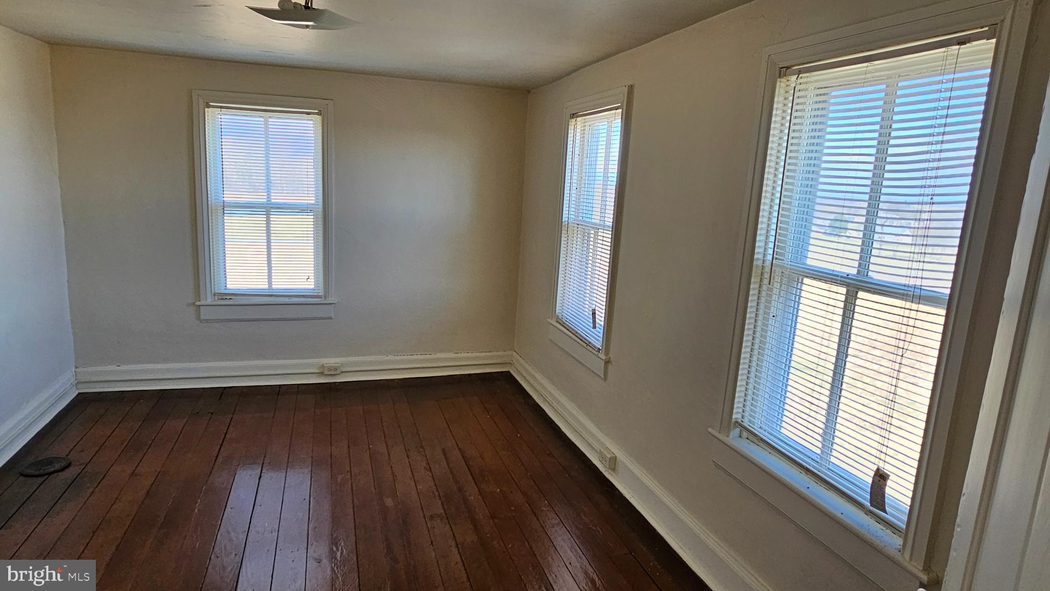 1 26.33 /- Acres Mountain Brook Road St. Thomas, PA 17252 - Photo 36 of 49 a view of an empty room with wooden floor and a window