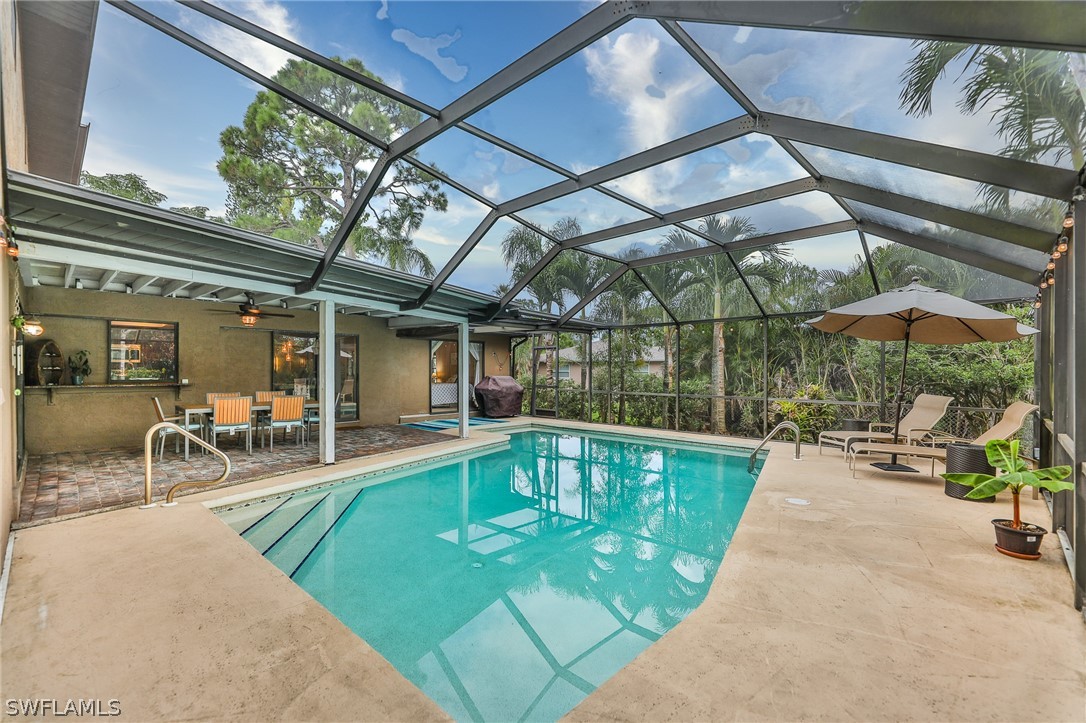 7213 Myrtle Road Fort Myers, FL 33967 - Photo 30 of 35 a view of a swimming pool with a patio