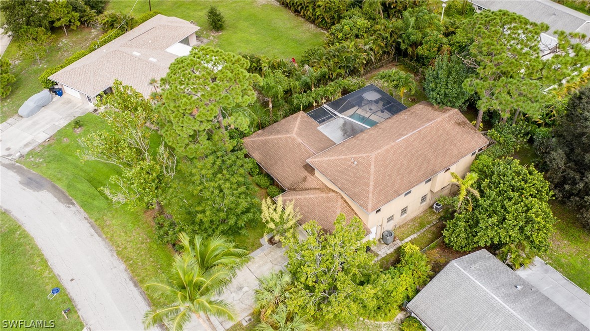 7213 Myrtle Road Fort Myers, FL 33967 - Photo 3 of 35 an aerial view of a house with a yard and plants