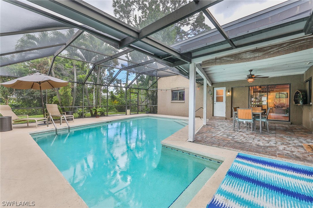 7213 Myrtle Road Fort Myers, FL 33967 - Photo 31 of 35 a view of a swimming pool with a patio