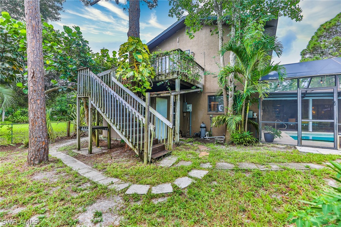 7213 Myrtle Road Fort Myers, FL 33967 - Photo 32 of 35 a view of a house with backyard and porch