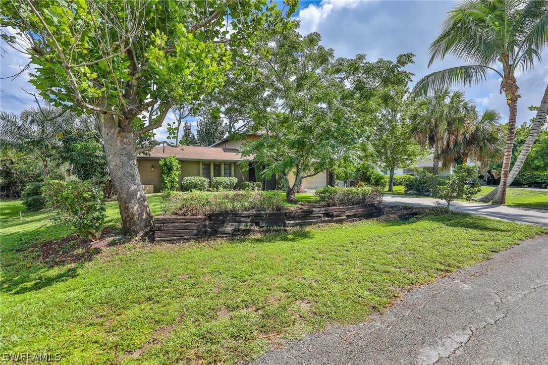 7213 Myrtle Road Fort Myers, FL 33967 - Photo 35 of 35 a view of house with backyard and outdoor seating