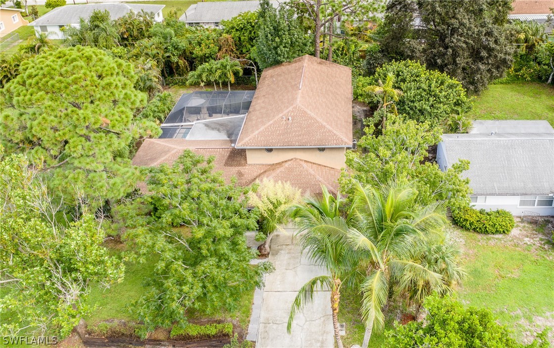 7213 Myrtle Road Fort Myers, FL 33967 - Photo 4 of 35 an aerial view of a house with swimming pool and garden