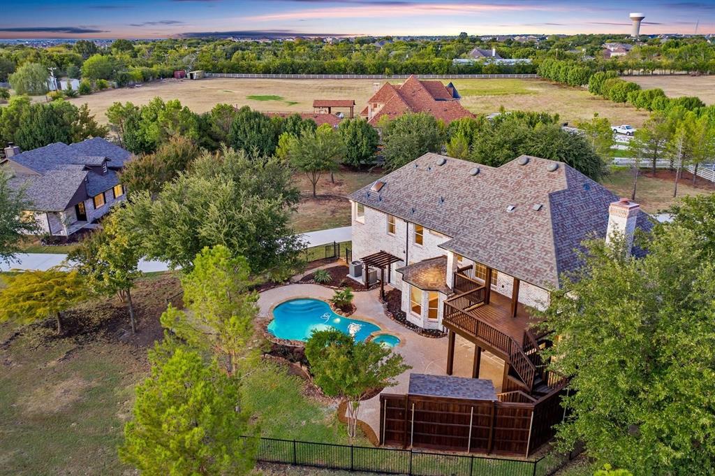 an aerial view of a house with a lake view