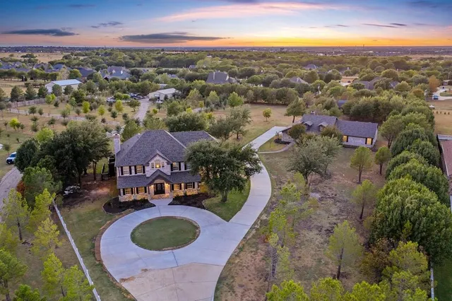 an aerial view of a house with outdoor space