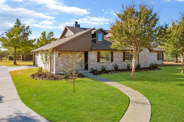front view of a house with a yard