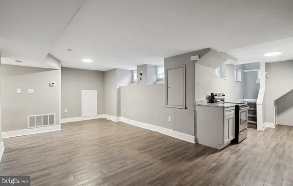a view of a kitchen with a sink and a refrigerator