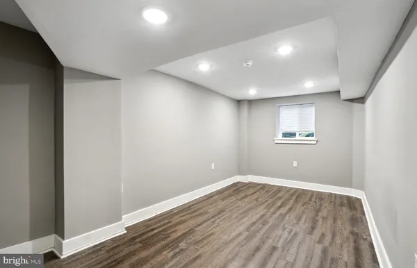 a view of room with wooden floor and window