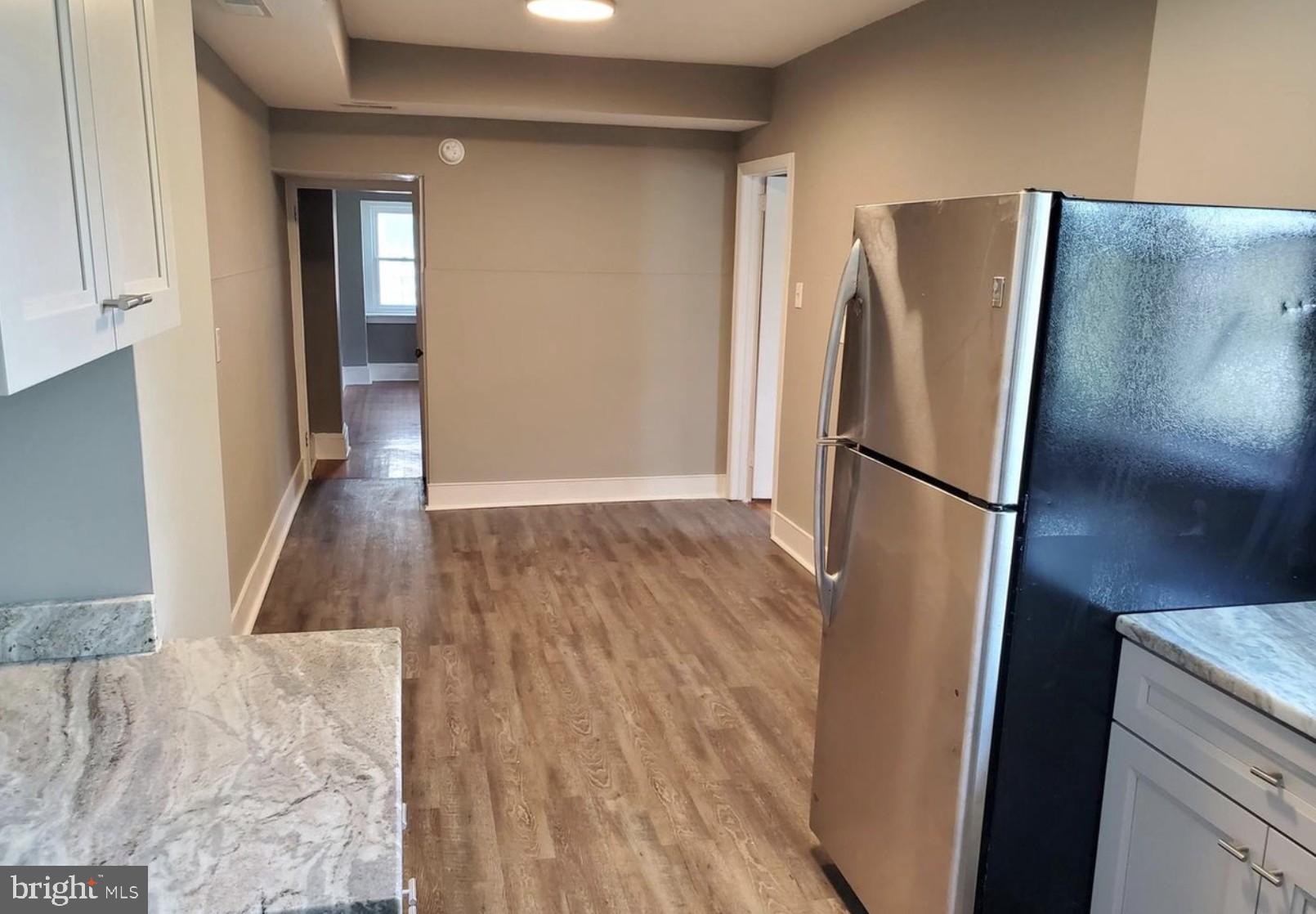 38 Copley Road Upper Darby, PA 19082 - Photo 9 of 22 a view of a refrigerator in kitchen and wooden floor