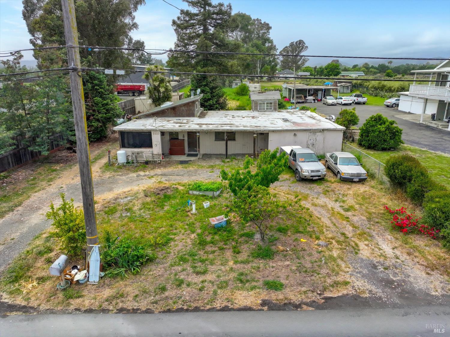 5537 Windsor Road Windsor, CA 95492 - Photo 1 of 1 a front view of a house with garden