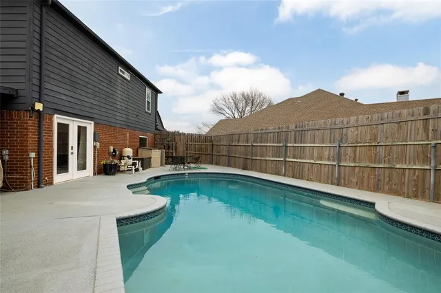 a view of a backyard with a patio