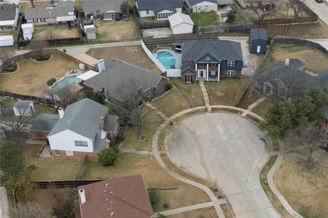 an aerial view of a house with outdoor space