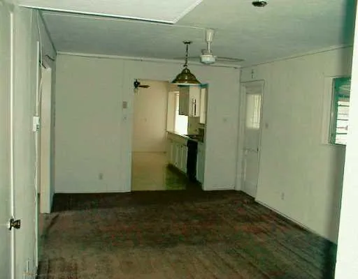 a view of a hallway with a bathroom