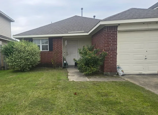 a view of a house with a garden