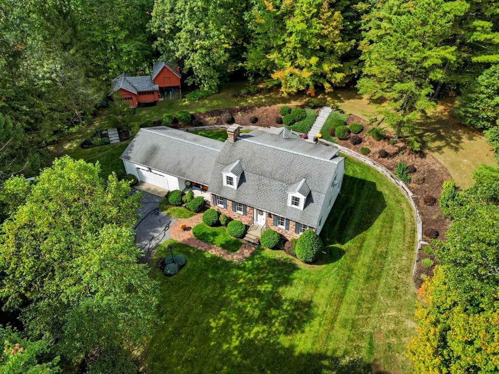 201 Belchertown Road Ware, MA 01082 - Photo 41 of 42 an aerial view of a house with a garden and large trees
