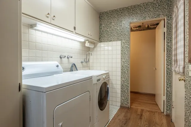 a utility room with dryer and washer
