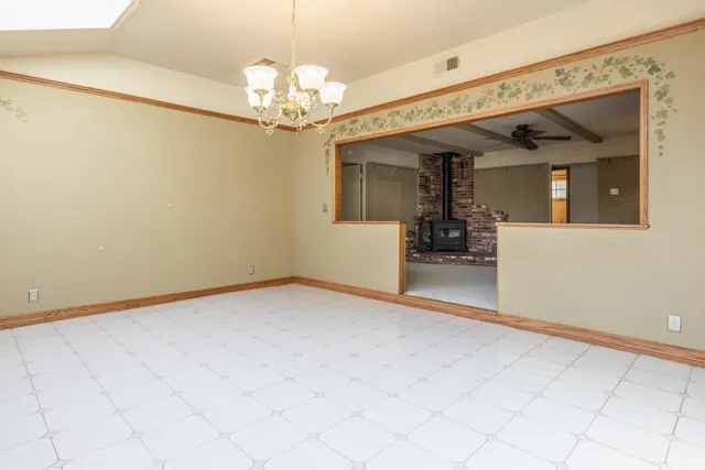 a view of a room with chandelier fan and furniture