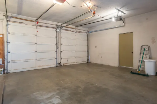 a view of a room with cabinet and mirrors