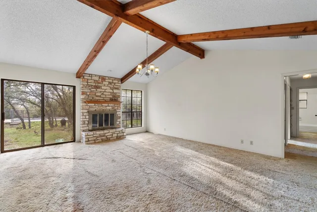 a view of an empty room with a balcony