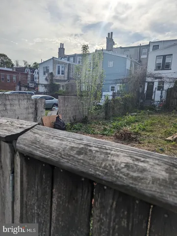 a view of a house next to a big yard