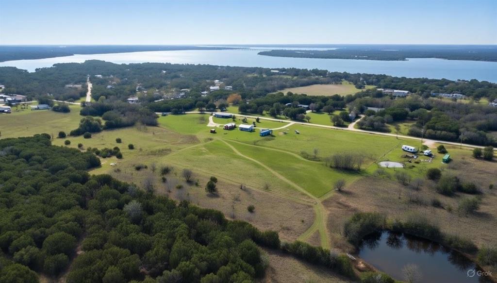 214 Cedar Creek Park Road Whitney, TX 76692 - Photo 1 of 32 View of rural area featuring a large body of water