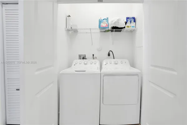 a utility room with dryer and washer