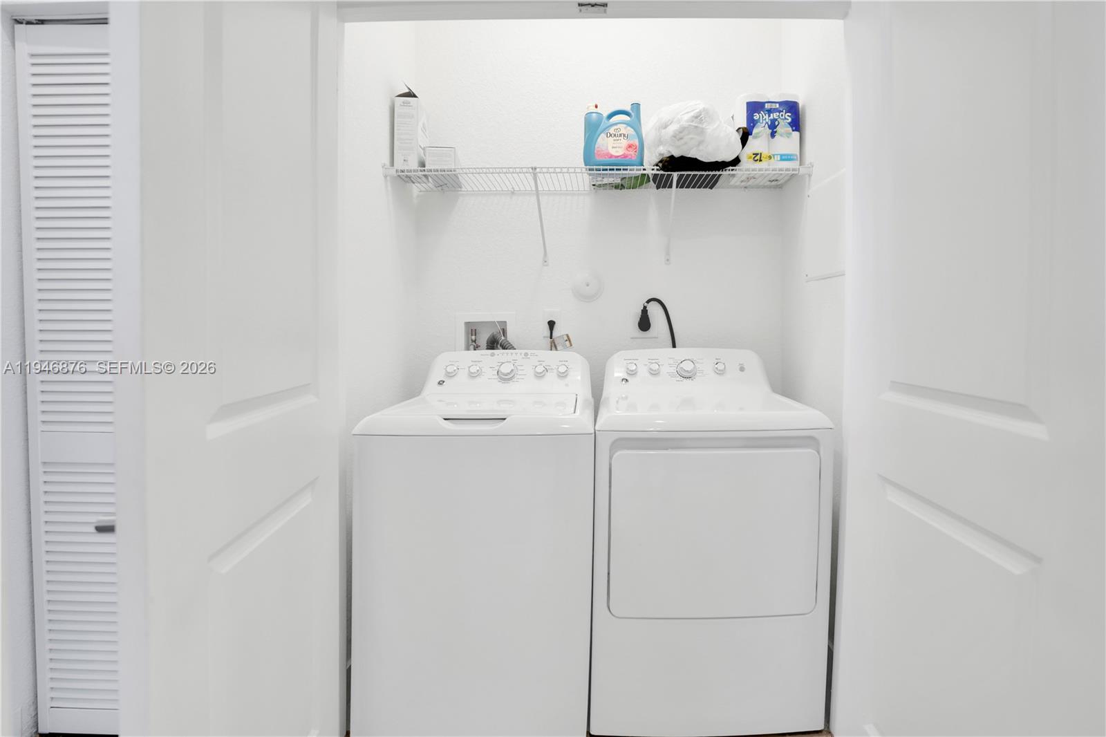 23302 Southwest 110th Avenue Homestead, FL 33032 - Photo 12 of 26 a utility room with dryer and washer