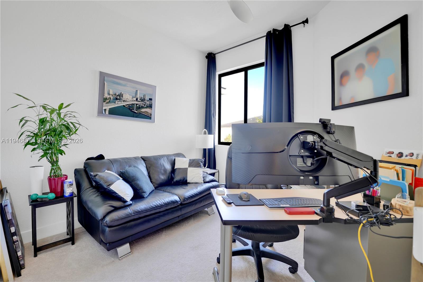 23302 Southwest 110th Avenue Homestead, FL 33032 - Photo 13 of 26 a living room with furniture and a potted plant