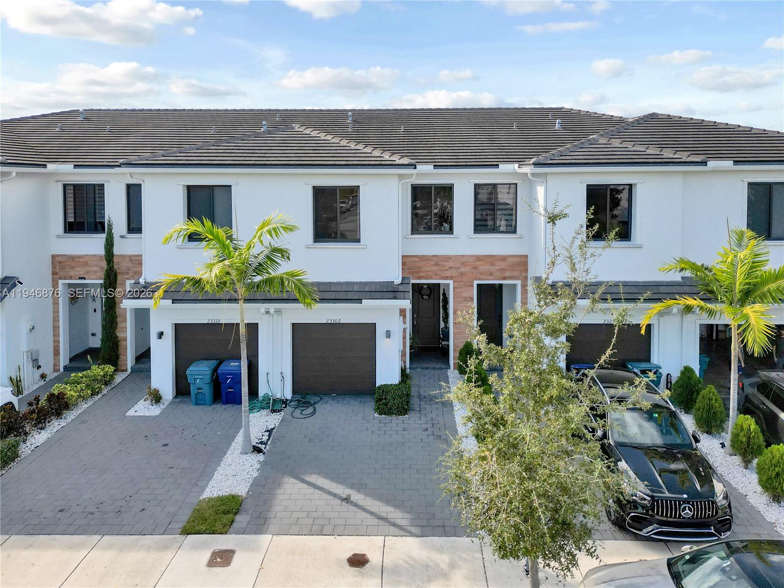 23302 Southwest 110th Avenue Homestead, FL 33032 - Photo 24 of 26 a front view of a house with a garden