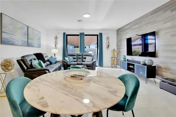 a living room with fireplace furniture and a flat screen tv
