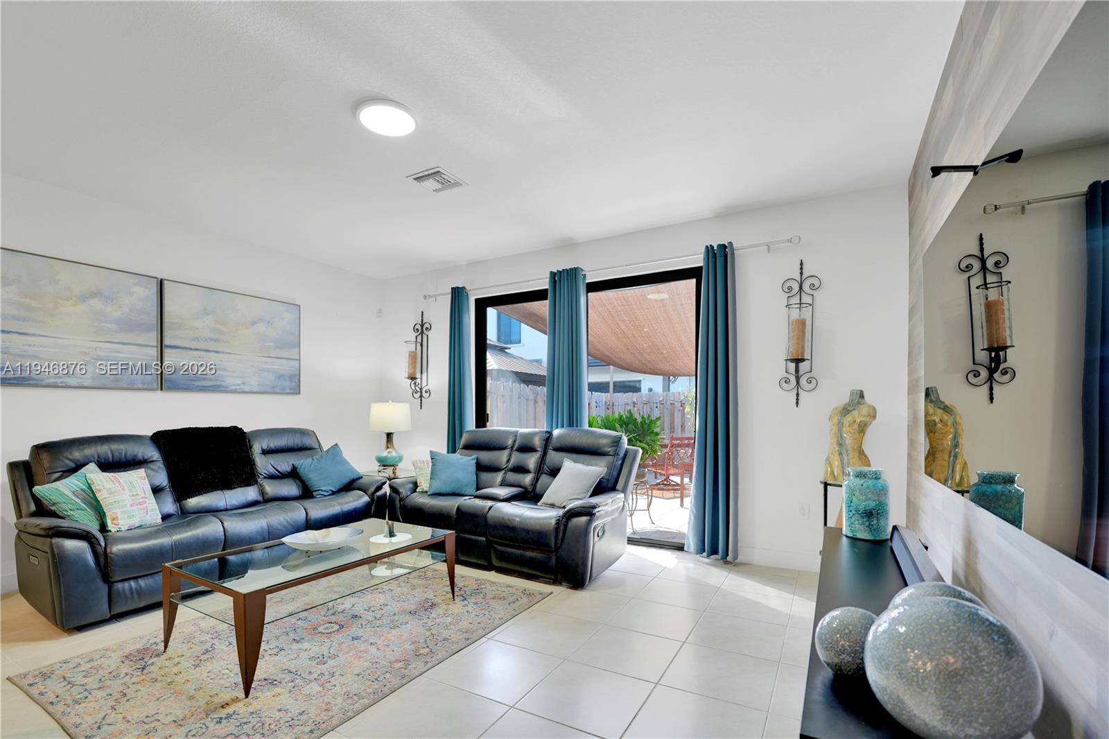 23302 Southwest 110th Avenue Homestead, FL 33032 - Photo 7 of 26 a living room with furniture and a large window