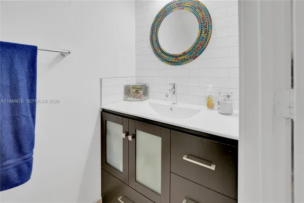 a bathroom with a sink and a mirror