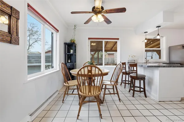 a dining room with furniture and window