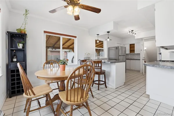 a dining room with furniture and window