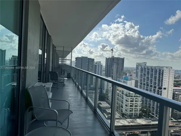 a view of a balcony with furniture