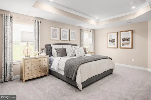 a spacious bedroom with a bed and a window