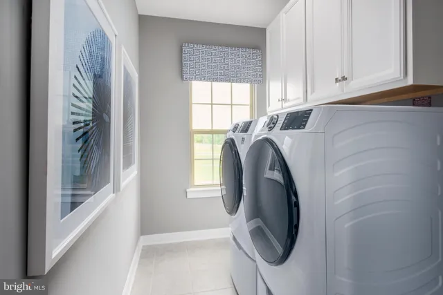 a utility room with window washer and dryer