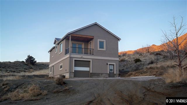 1240 Serpentine Road Reno, NV 89506 - Photo 1 of 13 a front view of a house with a yard
