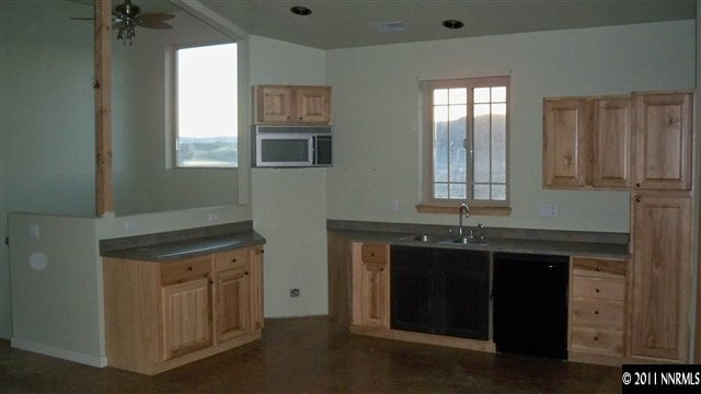 1240 Serpentine Road Reno, NV 89506 - Photo 4 of 13 a kitchen with a sink and cabinets