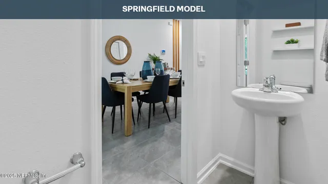 a view of a bathroom with a sink and mirror