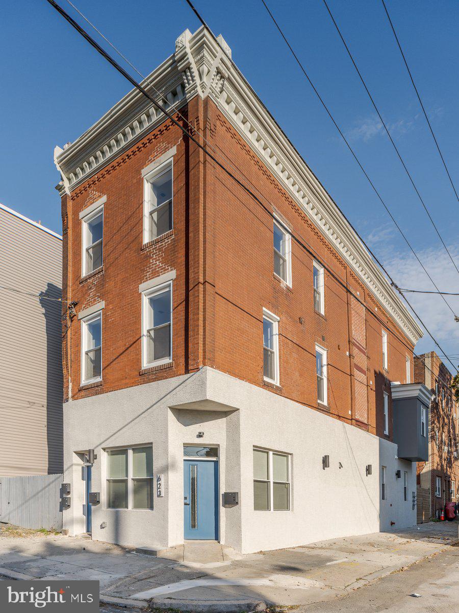 a tall building on the side of a street