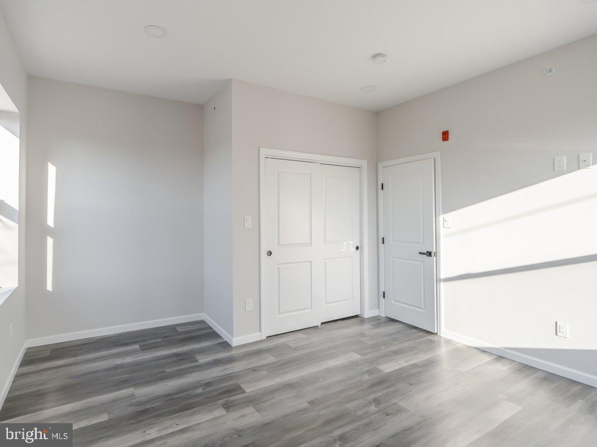 623 West Oxford Street Philadelphia, PA 19122 - Photo 21 of 39 a view of empty room with wooden floor and window