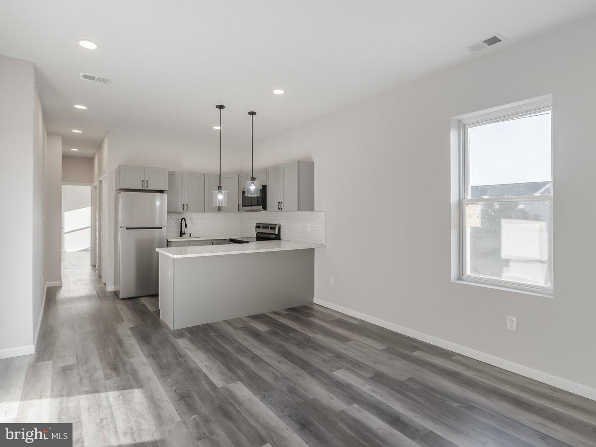 623 West Oxford Street Philadelphia, PA 19122 - Photo 24 of 39 a view of kitchen with wooden floor