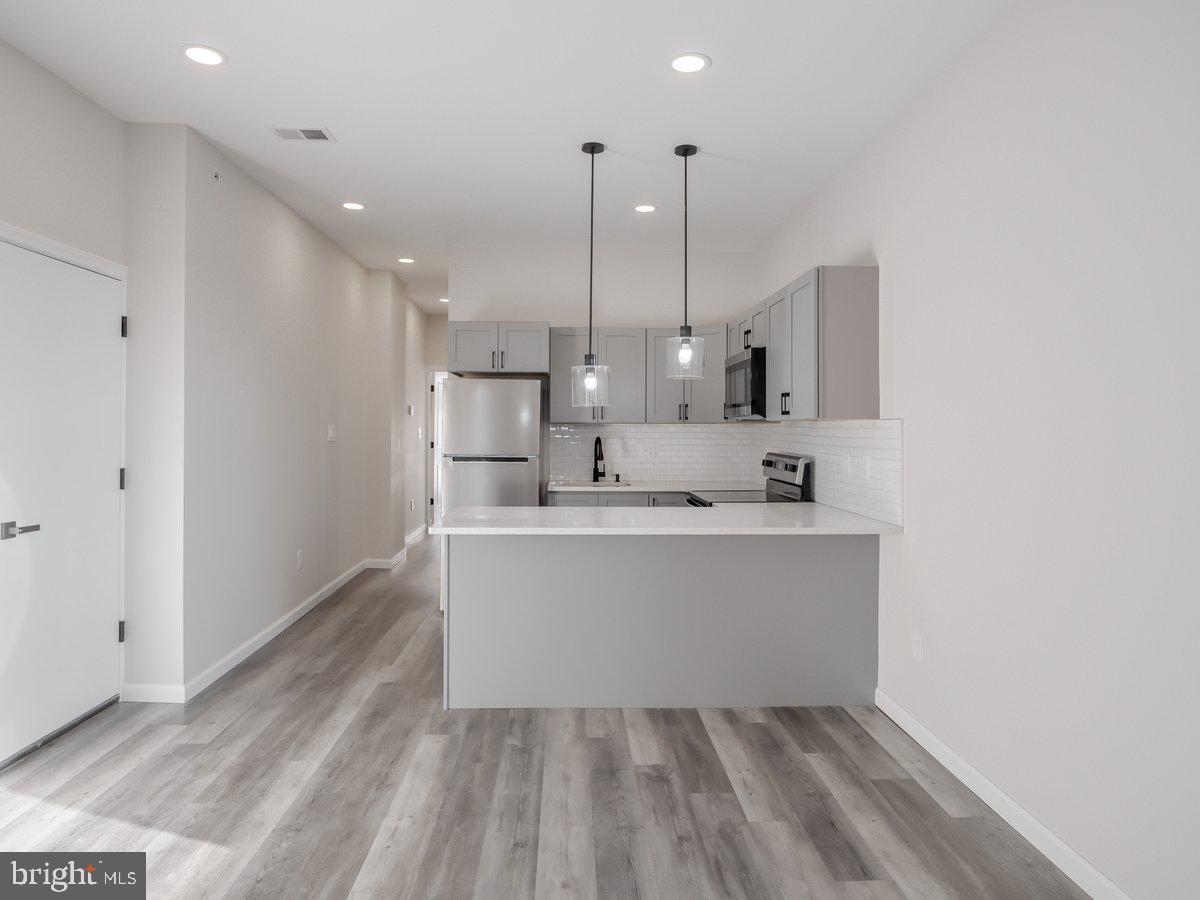 623 West Oxford Street Philadelphia, PA 19122 - Photo 3 of 39 a view of kitchen with wooden floor