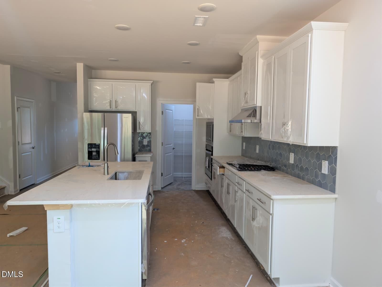 308 Karlov Road Garner, NC 27529 - Photo 8 of 55 a kitchen with a sink stove and refrigerator